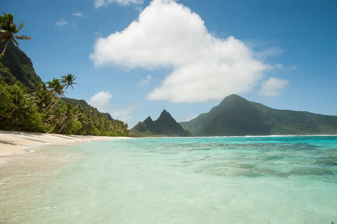 Clear turquoise water and the beach at Ofu in National Park of American Samoa.