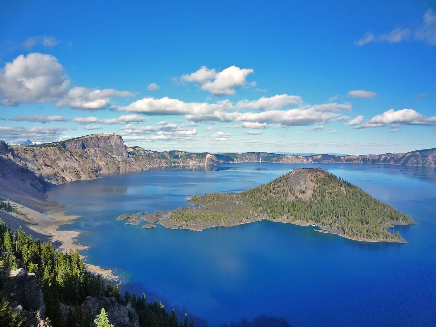 Blue Crater Lake surrounding Wizard Island in Crater Lake National Park.
