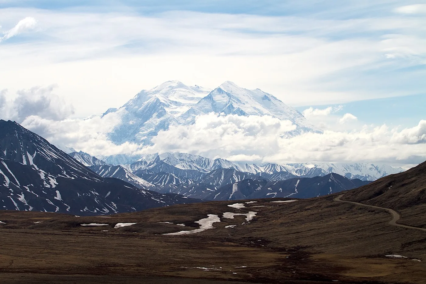 A snow-covered mountain above tundra, viewed from Stony Overlook in Denali National Park and Preserve.