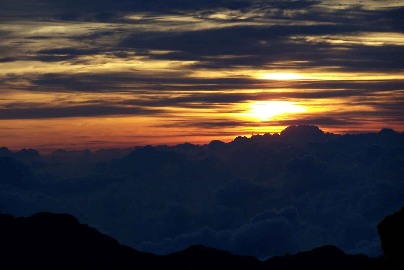 Sunset above a sea of clouds from Haleakala National Park.