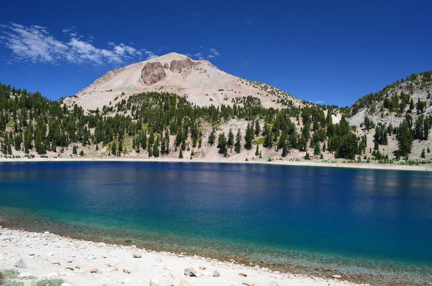Lassen Peak above blue Lake Helen in Lassen Volcanic National Park.