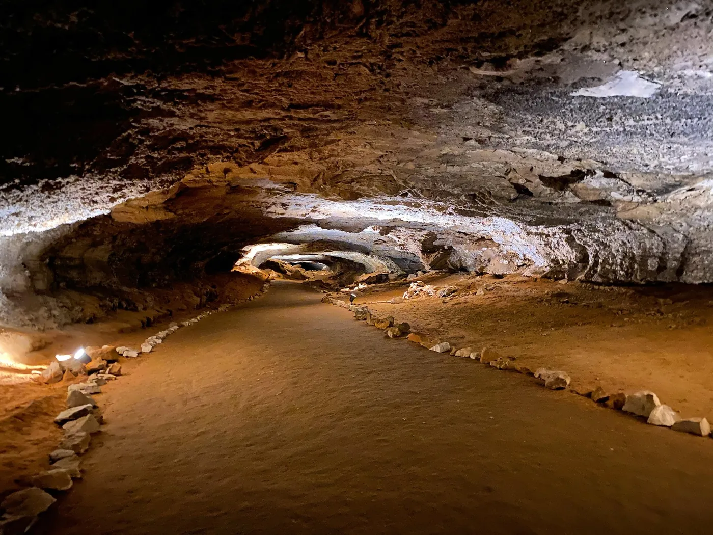An illuminated passage and walking route inside Mammoth Cave National Park.