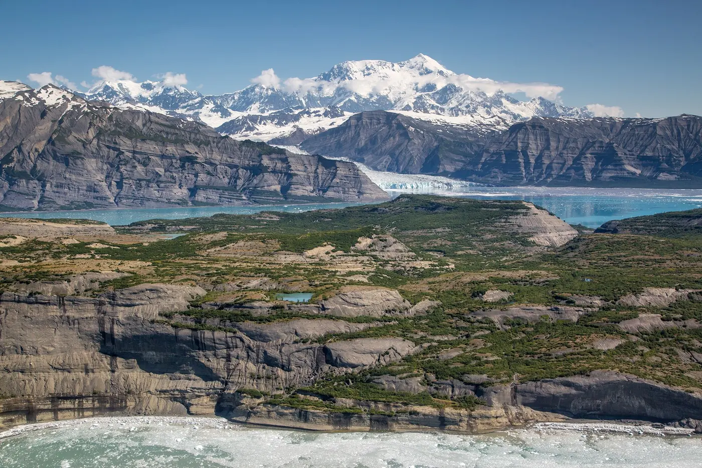 Glaciers, coastal water and snowy peaks in Wrangell-St. Elias National Park and Preserve.